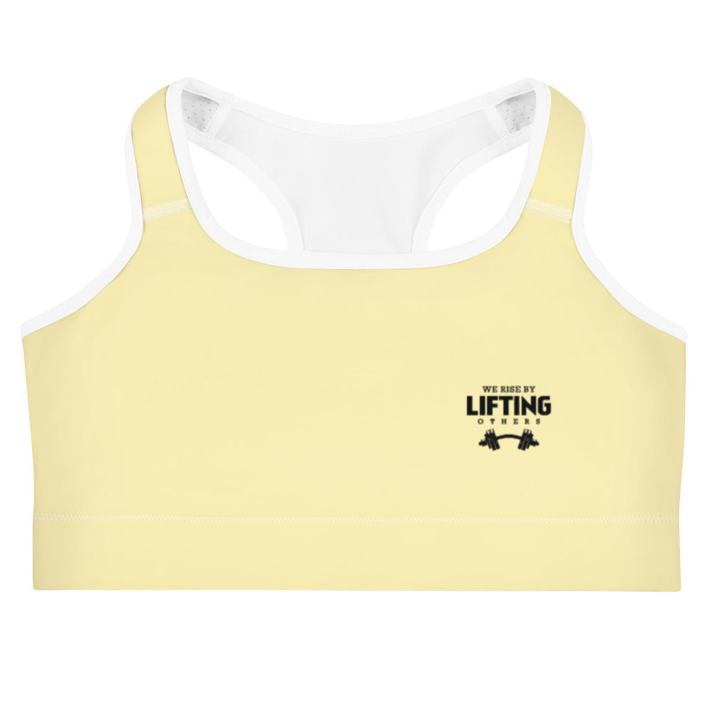 WE RISE BY LIFTING OTHERS - Sports bra